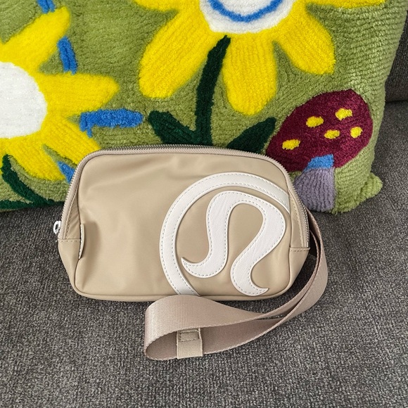 lululemon athletica Handbags - Lululemon Athletica Tan and White Crossbody Bag with Minimalist Design
